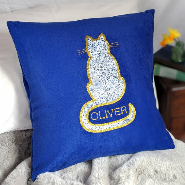 Blue fleece cushion with Liberty and gold glitter cat