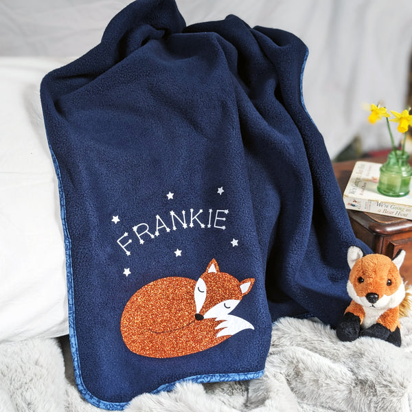 Navy fleece baby blanket with glitter fox personalised with baby's name. Great newborn gift.