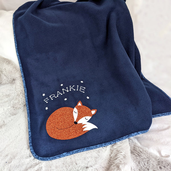 Navy fleece blanket with Liberty edging. Decorated with glitter fox and name.
